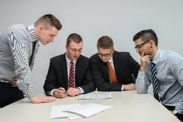 Recruitment team reviewing hiring requirements