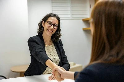 Recruiter welcoming a candidate during a professional interview